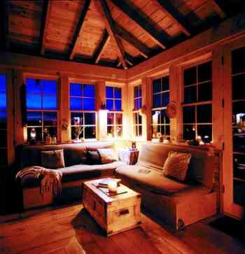 
A cozy living room corner is the perfect spot for viewing wildlife or a starry desert sky. Dick built four studio couches that pull out for extra sleeping space and provide seventy-six cubic feet of storage.
